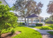 Thumbnail 8 of 23 - The Colony at Deerwood Apartments - Lakeside gazebo