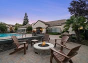 Thumbnail 8 of 18 - The Commons Apartments outdoor fire pit area with seating