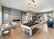 Thumbnail 8 of 32 - A large room with a pool table and a billiard table.