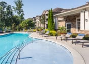 Thumbnail 8 of 19 - The Oaks at Johns Creek - Saltwater pool with sun ledge