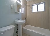 Thumbnail 9 of 14 - Tan tiled bath tubs in select units - Helios Apartments Miami Beach