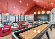 Thumbnail 9 of 21 - Arazo indoor game area with shuffle board and checkers