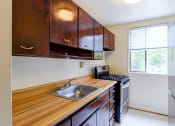 Thumbnail 9 of 21 - The Crestmont apartment interiors kitchen