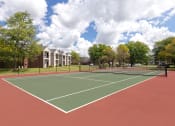 Thumbnail 9 of 18 - East Chase Apartments outdoor tennis court