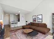 Thumbnail 9 of 16 - Spacious living room with wood-look flooring - Avenel at Montgomery Square