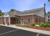 Thumbnail 9 of 16 - Leasing office building exterior - Hampshire Green Apartments