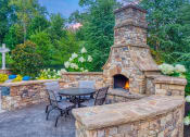 Thumbnail 9 of 19 - The Oaks at Johns Creek - Fireplace social area