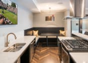 Thumbnail 9 of 22 - Gas stove and stainless steel sink in clubhouse kitchen - Onyx Edina