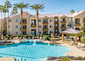 Thumbnail 9 of 23 - Resort-style swimming pool with ample lounge chairs available - Sonterra Apartments at Paradise Valley