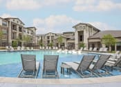 Thumbnail 11 of 25 - Sundeck surrounding resort-style pool - Debbie Lane Flats