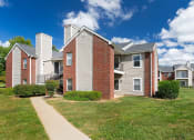 Thumbnail 10 of 18 - East Chase Apartments building exterior