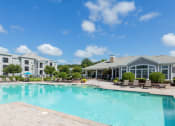 Thumbnail 10 of 24 - Courtney Station Apartments - Resort-style pool with spacious sundeck