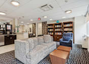 Thumbnail 11 of 28 - Resident library in the lounge area - Hill House at Chestnut HIll