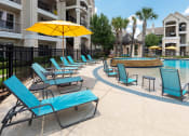 Thumbnail 11 of 23 - The Retreat at Cinco Ranch poolside tanning ledge