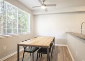 Thumbnail 11 of 17 - Lighted ceiling fans over dining area - Springbrook Apartments