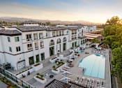 Thumbnail 11 of 20 - Aerial of the resort-style swimming pool and spa - The Venue at Orange