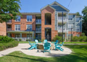 Thumbnail 13 of 24 - Belle Harbour Apartments outdoor fire pit