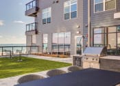 Thumbnail 13 of 22 - BBQ grilling area with seating area - BLVD at Revere Beach