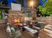 Thumbnail 13 of 28 - The Cascades Apartments fireplace lounge