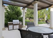 Thumbnail 13 of 30 - The Fairways at Corbin Park poolside cabana with BBQ grill and seating
