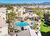 Thumbnail 13 of 23 - Aerial picture of property including resort-style swimming pool and buildings - Sonterra Apartments at Paradise Valley