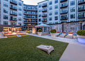 Thumbnail 14 of 24 - Outdoor lounge with games and fire pit - Rockwell at Crown