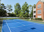Thumbnail 15 of 28 - Lighted tennis court - Belle Harbour Apartments
