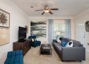 Thumbnail 15 of 21 - Carrington at Shoal Creek - Staged living room with ceiling fan