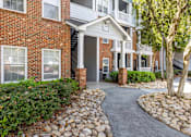 Thumbnail 15 of 29 - Well-manicured pathways throughout the property - Evergreen Lenox Park