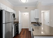 Thumbnail 16 of 25 - Wood-style flooring in select units