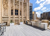 Thumbnail 17 of 21 - Rooftop outdoor kitchen with BBQ grills and seating - The Kirby