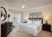 Thumbnail 18 of 21 - Carrington Place at Shoal Creek - Carpeted bedroom with ceiling fan