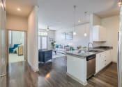 Thumbnail 18 of 26 - Centre Pointe Apartments stainless steel appliances and high ceilings