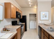 Thumbnail 18 of 22 - Cordillera Ranch Apartments side-by-side laundry machines