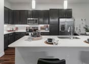 Thumbnail 19 of 25 - Espresso wood cabinetry - Debbie Lane Flats