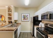 Thumbnail 19 of 24 - Belle Harbour Apartments stainless steel appliances