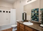 Thumbnail 19 of 21 - Carrington Place at Shoal Creek - Sleek bathrooms with wood-style flooring