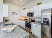 Thumbnail 19 of 26 - Centre Pointe Apartments stainless steel appliances