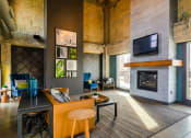 Thumbnail 22 of 27 - Resident clubhouse great room with fireplace - Eitel Apartments
