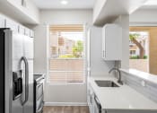 Thumbnail 23 of 26 - Renovated quartz countertops in updated units - Arrowhead Landing Apartments