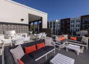 Thumbnail 22 of 41 - Rooftop deck with a fireplace and outdoor cooking station - NOVA at Green Valley