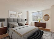 Thumbnail 26 of 28 - A bedroom with a large bed and a window.