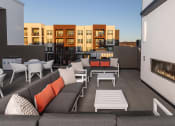 Thumbnail 23 of 41 - Rooftop deck with a fireplace and outdoor cooking station - NOVA at Green Valley