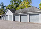 Thumbnail 27 of 29 - A two-car garage with a grey roof and white walls.