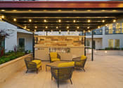 Thumbnail 29 of 32 - Outdoor fireplace with seating - La Via Apartments