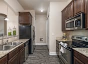 Thumbnail 27 of 37 - Granite countertops with  mosaic backsplash - Monterra Las Colinas Apartments