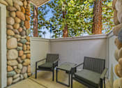 Thumbnail 29 of 30 - Two chairs and a table are on a patio.