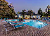 Thumbnail 29 of 29 - A pool with lounge chairs and a house in the background.