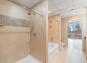 Thumbnail 33 of 36 - a large bathroom with a shower and a tub in it