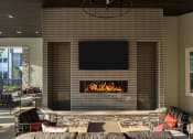 Thumbnail 7 of 21 - Drift Town Center East outdoor fireplace and seating area